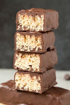 chocolate bars stacked on top of each other with coconut flakes and chopped walnuts