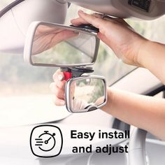 the woman is driving in her car and she has an easy install and adjust mirror