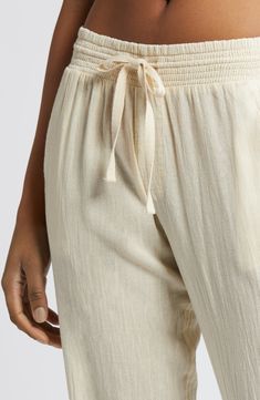 Softly crinkled and gently tapered, these gauzy cotton pants are the wearable equivalent of a day spent lounging on the beach. 28" inseam; 10 1/2" front rise; 14 1/2" back rise Elastic/drawstring waist Front slant pockets; back patch pockets 100% cotton Machine wash, dry flat Imported BP. Summer Loungewear Harem Pants With Tapered Leg, Summer Loungewear Tapered Leg Harem Pants, Summer Tapered Leg Harem Pants For Loungewear, Casual Summer Pants With Crinkle Texture, Spring Cotton Bottoms With Crinkle Texture, Summer Loungewear Bottoms With Crinkle Texture, Summer Loungewear Pants With Crinkle Texture, Surf Pants, Ripped Pants