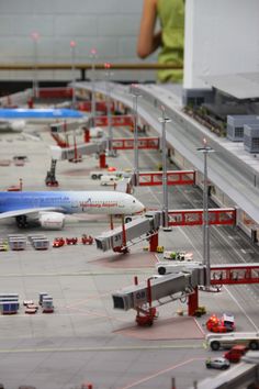 several model airplanes are lined up on the runway