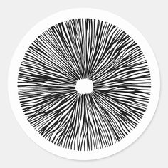 an abstract black and white design on a round sticker with lines in the center