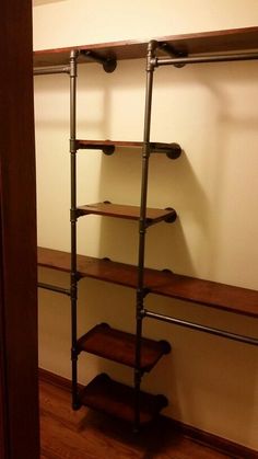 an empty closet with shelves and shelving unit