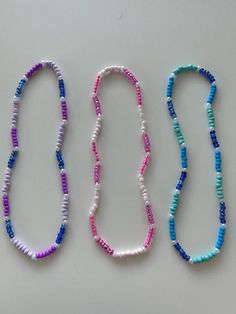 These SUPER stretchy necklaces will surely make your summer longer! Ocean themed necklaces, bright pink necklaces, purple and pink/teal necklaces! Everything you need to make your outfits look super cute and trendy! Trendy Turquoise Necklace With Round Beads, Trendy Beaded Necklace With Colorful Turquoise Beads, Trendy Turquoise Beaded Necklaces With Round Beads, Trendy Turquoise Necklaces With Tiny Beads, Trendy Purple Jewelry With Tiny Beads, Trendy Turquoise Round Beaded Necklace, Trendy Turquoise Beaded Necklace, Trendy Purple Jewelry With Spacer Beads, Pink Beaded Charm Necklaces With Round Beads