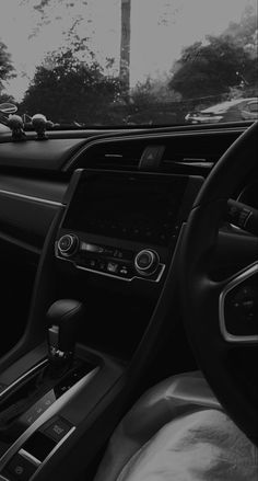 the interior of a car is shown in black and white