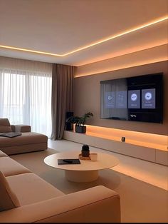 a living room filled with furniture and a flat screen tv mounted to the side of a wall