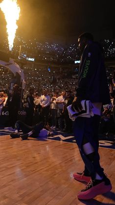 NBA basketball wallpaper background of Minnesota Timberwolves star Anthony Edwards at the pre-game ceremony with fireworks going off behind him Anthony Edwards Wallpapers 4k, Anthony Edwards Wallpaper, Basketball Background Aesthetic, Lock Screen Aesthetic, Wallpaper Background Aesthetic, Aesthetic Sports, Basketball Background, Kobe Bryant Wallpaper, Nba Wallpapers