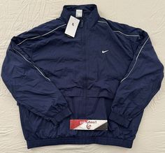 Nike Sportwear Solo Swoosh Woven Track Jacket FB8622-410 Size: Mens Size Large Color: Thunder Blue New with tags. 100% Authentic Nike Product! Any question feel free to contact us. *****IMPORTANT***** ***No returns accepted*** Return Policy. Due to high cost of shipping, WE DO NOT take any RETURNS DUE TO SIZE FITTING, and COLOR ISSUE. ***Items 100% Authentic.*** We guarantee all of our items are authentic. Items on the photos and description is the one you’re getting guarantee. ***International Nike Nylon Track Jacket For Streetwear, Nike 2000s, Nike Navy Sports Outerwear, Nike Vintage Track Jacket, Nike Technical Sports Windbreaker, Navy Sportswear Outerwear With Pockets, Nike Windbreaker Jacket Vintage, Old Nike, Nike Track Jacket With Moisture-wicking For Outdoor