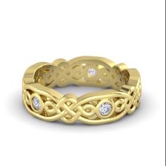 a yellow gold ring with diamonds on it