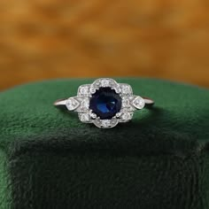 Round Saphire Ring, Vintage Sapphire Engagement Ring 1920s Art Deco Diamond, Heirloom Blue Sapphire Birthstone Ring, Blue Sapphire Heirloom Ring With Halo Design, Heirloom Blue Sapphire Promise Ring, Art Deco Halo Setting Rings As A Gift, Royal Blue Sapphire Ring With Diamond For Gift, Lab-created Sapphire Round Band Jewelry As Gift, Lab-created Sapphire Round Band Jewelry Gift