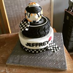 a motorcycle themed cake on top of a table