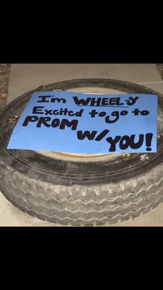 a sign that says i'm wheely excited to prom with you