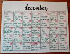 a printable december calendar on a wooden table