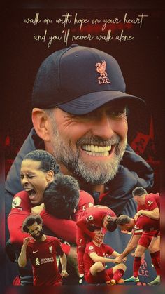 an old man with a beard wearing a liverpool shirt and hat is surrounded by his team mates