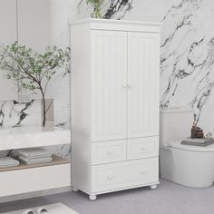 a bathroom with marble walls and flooring, including a white cabinet next to the toilet