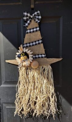 a scarecrow hat hanging on the front door