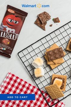 some cookies and marshmallows are on a cooling rack