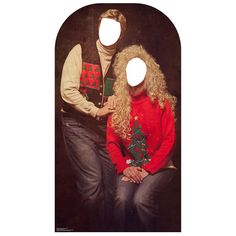 a man and woman wearing ugly sweaters with christmas trees on their heads are standing next to each other