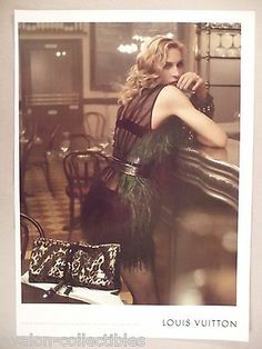 an old photo of a woman leaning on a table with a purse in her hand