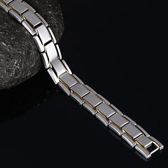 Bold and unique, this bracelet makes an adorable gift for people who are looking for a men's bracelet. Crafted in titanium steel, the bracelet shows a unique and pristine look. Just take this handsome design. It won't disappoint you! Material: Titanium SteelPlating Color: Silver, Yellow Gold Modern Durable Silver Bracelets, Modern Silver Tungsten Carbide Jewelry, Modern Magnetic Jewelry For Gifts, Modern Magnetic Bracelet Jewelry, Modern Silver Magnetic Bracelet, Modern Silver Magnetic Bracelets, Minimalist Silver Magnetic Bracelet, Silver Minimalist Magnetic Bracelet, Minimalist Magnetic Silver Bracelet