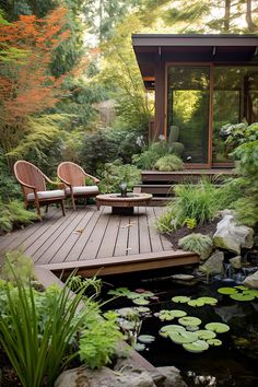 two chairs sitting on top of a wooden deck next to a pond with lily pads