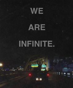 a black and white photo with the words we are infinite in front of it at night