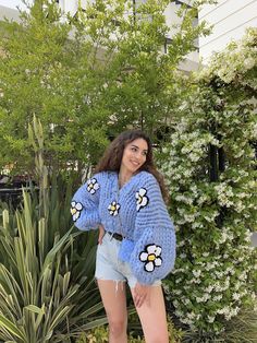 IG : @heyays Material: The sweater is knitted using 100% merino wool. The flowers on it are 100% premium acrylic. Model wears S/M. (168 cm 54 kg) Caring Tips -Please do not wash in the washing machine. We recommend professional dry cleaners or hand washing. You can also do spot stain cleaning with the help of a wet cloth. -Store your Heyays knitwears by folding them instead of hanging them. -When purchasing your knitwear piece, please take into consideration that pilling may occur when worn. Due Oversized Knitwear, Handmade Bouquet, Chunky Baby, Handmade Bouquets, Sweater Chunky, Cloth Store, Dry Cleaners, Chunky Knitwear, Blue V