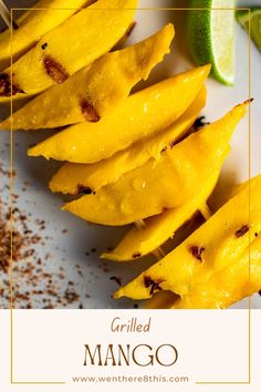 grilled mango on a white plate with garnish and seasoning next to it