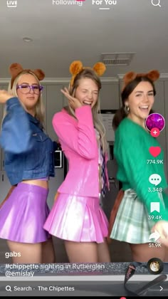 three girls are dressed up in costumes and posing for the camera with their hands on their hips