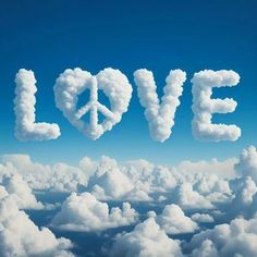 the word love is written in the sky above clouds