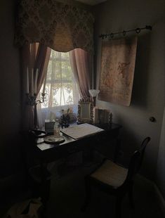 a room with a desk, chair and window in it's dark lighting area