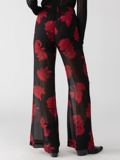 DETAILS Standard Rise Sheer Pant Rose Pattern with Short Lining Fitted Back Elastic Waistband SIZE + FIT Model is 5'8" and wearing a size S. Waist: 29" Front Rise: 11" Inseam: 33" Leg Opening: 28" FABRIC + CARE Shell: 100% Recycled Polyester | Lining: 100% Polyester Polyester Paraguay Machine Wash Cold, Line Dry Imported MADE WITH SUSTAINABILITY IN MIND Recycled polyester is produced from recycled petroleum sources: PET bottles, industrial polyester waste, and even garments. Production requires Chic Rose Print Bottoms For Spring, Chic Spring Bottoms With Rose Print, Stretch Floral Print Bottoms For Party, Red Floral Print Party Bottoms, Casual Floral Print Bottoms For Party, Party Red Floral Print Bottoms, Linen Leggings, Sheer Pants, Denim Short Dresses