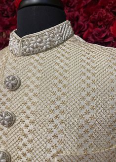 The Darpan Sherwani exudes sophistication with its elegant ivory tone and intricate textured pattern. This timeless sherwani is a perfect choice for weddings and formal celebrations, offering a regal look with unmatched craftsmanship. Key Features: Elegant Design: Ivory sherwani with detailed textured patterns. Premium Fabric: Crafted with high-quality materials for comfort and style. Customizable Accessories: Dupatta, mojari, safa, and jewelry can be tailored to your preference. Color - Ivory W