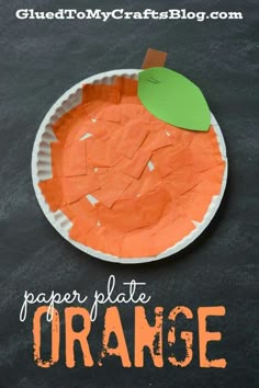 an orange paper plate on a chalkboard with the words paper plate orange cut out