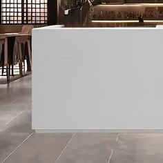 a white counter sitting in the middle of a kitchen