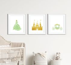 three framed pictures on the wall above a crib