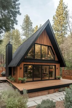 a large wooden house sitting in the middle of a forest