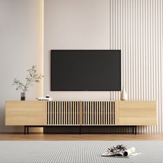 a flat screen tv mounted to the side of a wooden cabinet in a living room