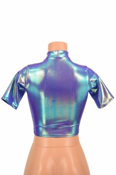 "This item is made to order, please read all the way through the listing before purchasing! This shiny, liquidy holographic top has a smooth reflective finish that bends the light in beautiful shifting rainbows. It features a high short collar neckline and cute little tee length sleeves. Four way stretch spandex for a great fit! TOP LENGTH: Underarm to hemline measures 8\" Womens Sizing (See below for instructions on where measurements should be taken) XXS: Bust 29\"-30\" / Waist 22\"-23\" / Hip Trendy Fitted Shiny Tops, Fitted Metallic Shiny Tops, Fitted Iridescent Tops, Metallic Shiny Fitted Tops, Metallic Shimmer Top For Disco, Metallic Shiny Disco Top, Metallic Shimmer Disco Top, Metallic Shiny Stretch Tops, Metallic Stretch Disco Top