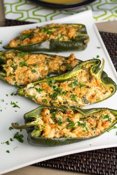 stuffed peppers with cheese and herbs on a white plate