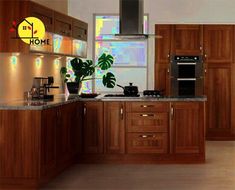 a modern kitchen with wooden cabinets and stainless steel appliances, along with potted plants