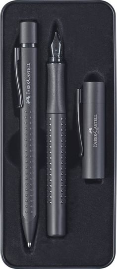 three different types of pens in a black box with silver trimmings on it