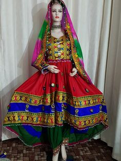 These Afghan clothes are prepared from good quality Satin fabric. A lot of mirrors are fixed on the dress, which shines in the light. Traditionally, such Persian Pashtun tribal clothes are used for special events like wedding, Nikkah, engagements. Many girls also like to wear it while performing art dances like Attan on high crowded stage. The design is newer and according to current fashion. Note: Regular sizes are available you can message for small and large sizes it will take 3 to 4 days in Dress Unique Style, Afghan Kuchi Dress, Afghan Wedding Dress, Robe Diy, Belly Dance Accessories, Islamic Events, Afghan Dress, Afghan Wedding, Belly Dance Jewelry