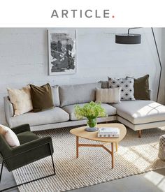 a living room filled with furniture and pillows