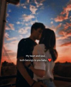 a man and woman kissing in front of a sunset with the words, my heart and soul, both belong to you baby