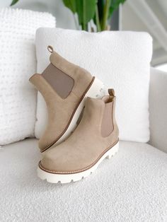 Introducing the boot of the season in a gorgeous khaki hue, the Stella Boot! These boots are a classic bootie which features a round toe, elastic sides and a pull tab for an easy fit. It also features a contoured footbed and sits on a 1.5-inch-stacked heel making it cute and comfortable for everyday wear. Khaki Round Toe Winter Boots, Beige Suede Chelsea Boots For Fall, Everyday Ankle Boots For Winter, Everyday Winter Ankle Boots, Winter Everyday Ankle Boots, Beige Suede Chelsea Boots With Round Toe, Beige Casual Chelsea Ankle Boots, Everyday Slip-on Boots For Fall, Trendy Slip-on Boots With Lug Sole