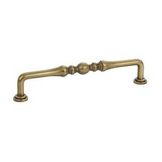 an antique brass handle on a white background