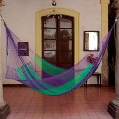 Evoking ripe sea grapes the Maya Artists of the Yucatan select purple and green for this colorful hammock. They weave it by hand in the same way they have for centuries. Long before the Spanish arrived upon the coasts of the Yucatan Peninsula the Maya preferred to sleep and rest in hammocks. They considered the hammock to be like the loving embrace of a mother due to the comfortable manner in which the body is held and swung within its cradle. Maya Artists of the Yucatan seek to preserve time-ho Hammock Ideas, Sea Grapes, Hammock Hooks, Whimsical Yard, Knotted Rope, Rope Hammock, Purple Stuff, Best Outdoor Furniture, Hammock Stand