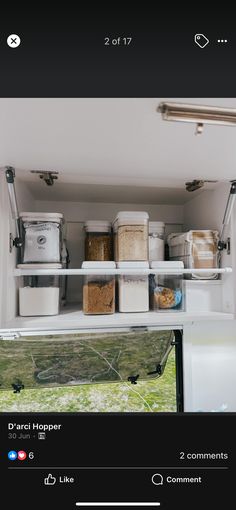 the inside of a camper with several containers and bins on it's shelf