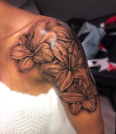 a woman's arm with flowers on it