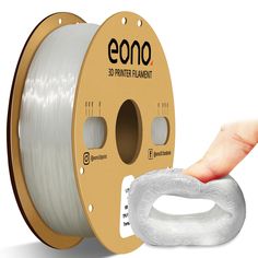 a spool of white filament being held by a hand